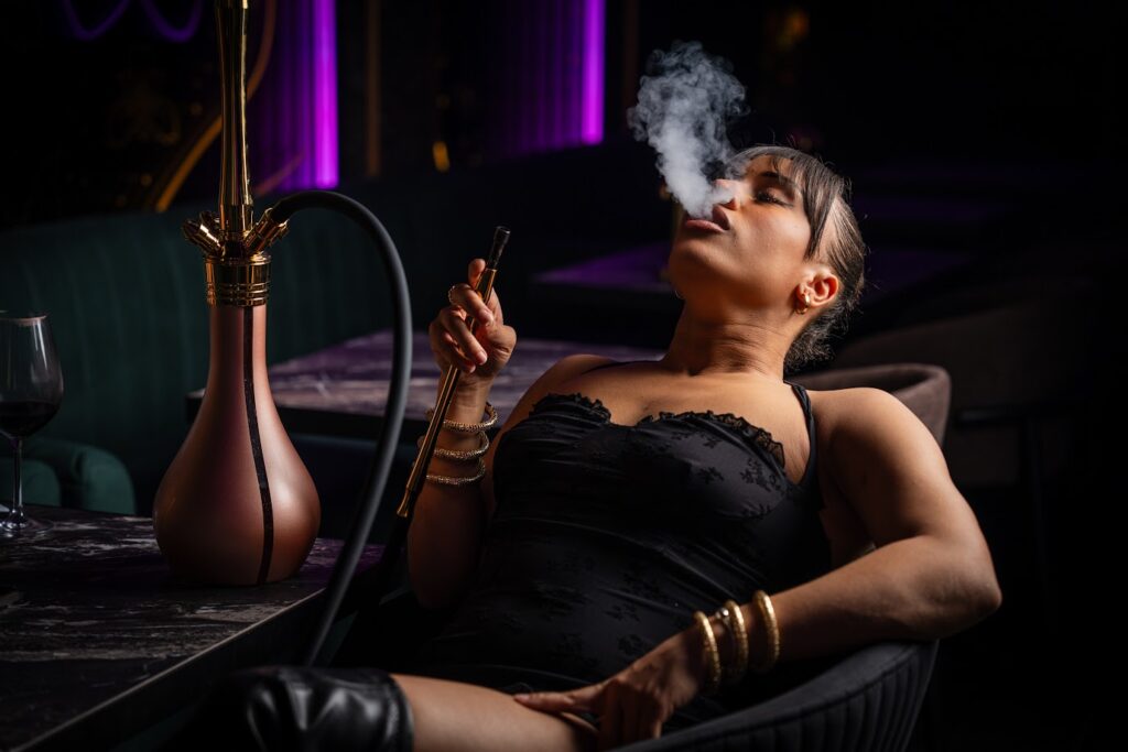 Girl trying out shisha flavour at London's best shisha lounge